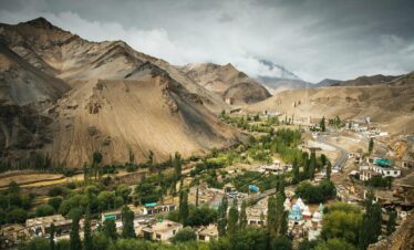 Breathtaking landscape view of Lamayuru Monastery nestled amidst the rugged mountains of Ladakh.