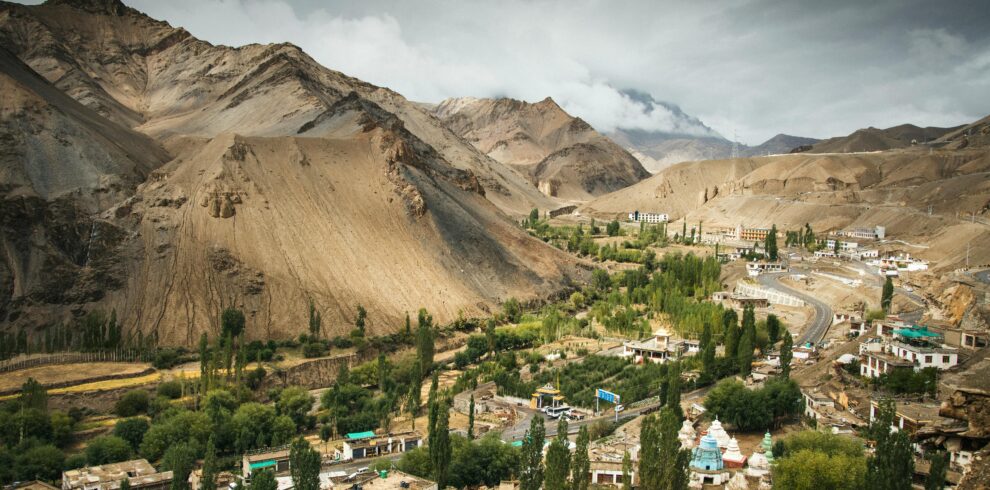 Breathtaking landscape view of Lamayuru Monastery nestled amidst the rugged mountains of Ladakh.